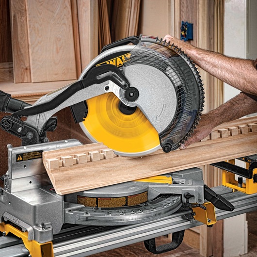 12 Inch Miter Saw Blade being used to slice a wooden plank.