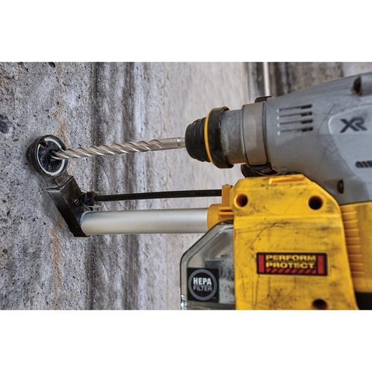 SDS Plus 2 Cutter Drill Bit being used to drill through concrete wall.